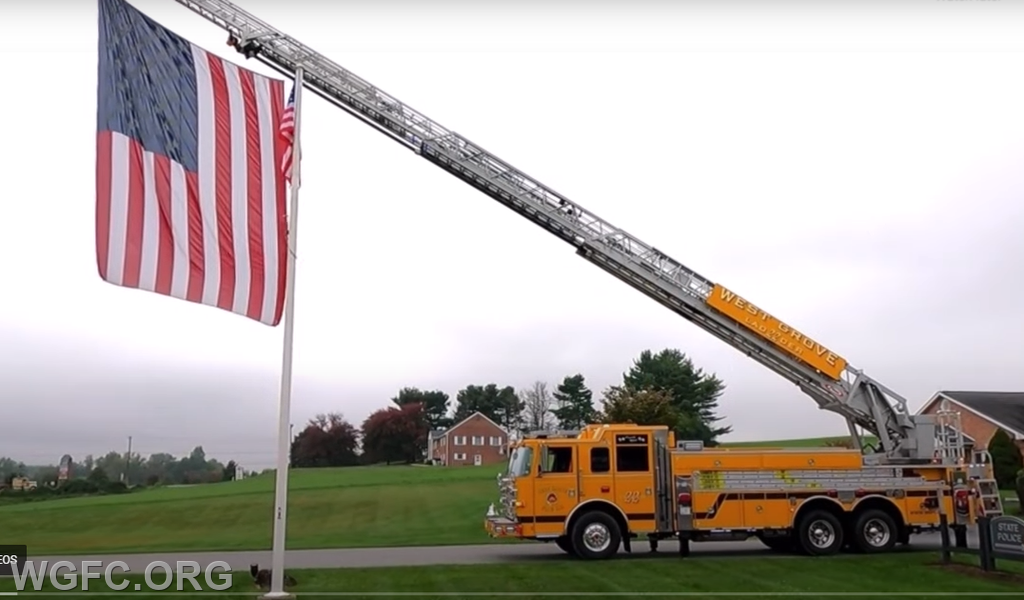 Ladder 22 flies WGFC's large US Flag.