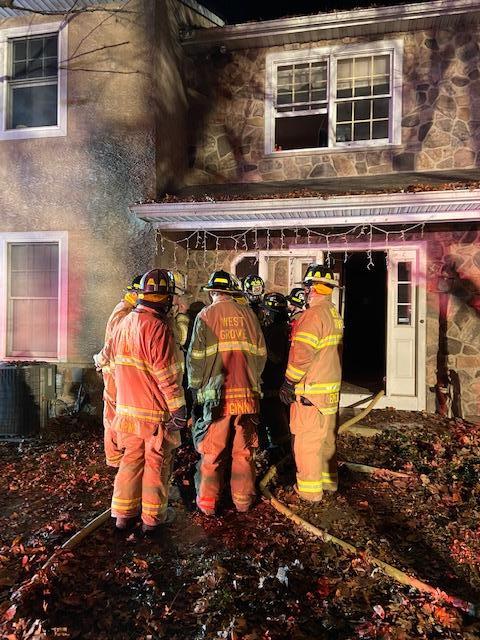 WGFC firefighters confer during the later stages of this house fire.