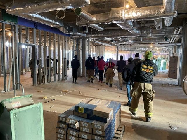 Crews walk through the food service area into the cafeteria.