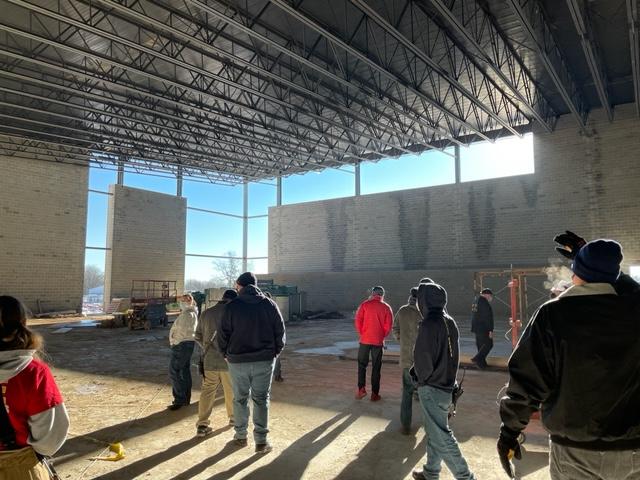 WGFC members view the main gymnasium, which will seat 2,000 people.