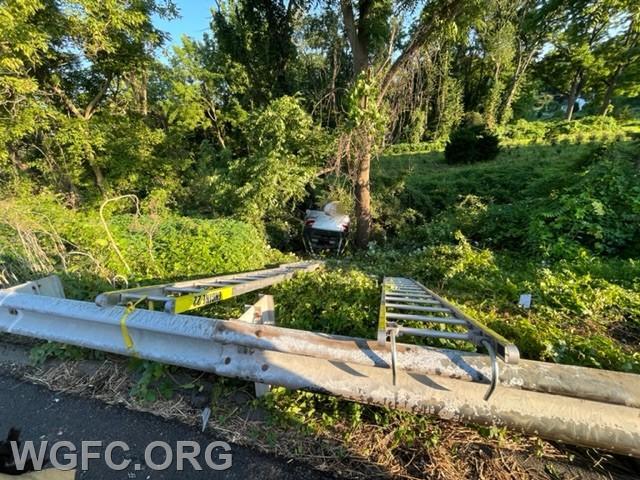WGFC's rescue involved using two ladders secured to the guide rail to help crews access and remove the patient from well below the highway.  Patient removal was accomplished in 12 minutes.