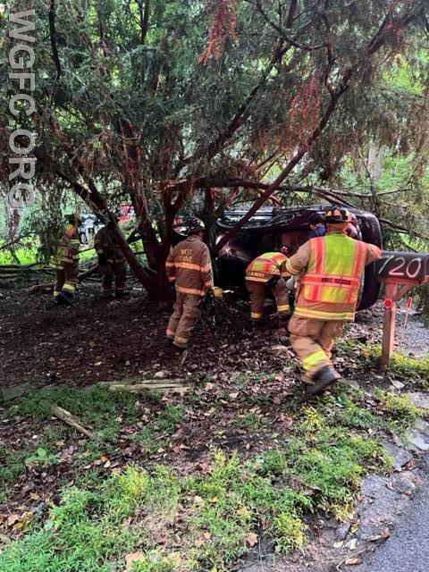 WGFC firefighters stabilize a car on its side, with a victim trapped, on Chambers Rock Road. 