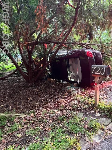 A view of the car on its side, just off Chambers Rock Road.