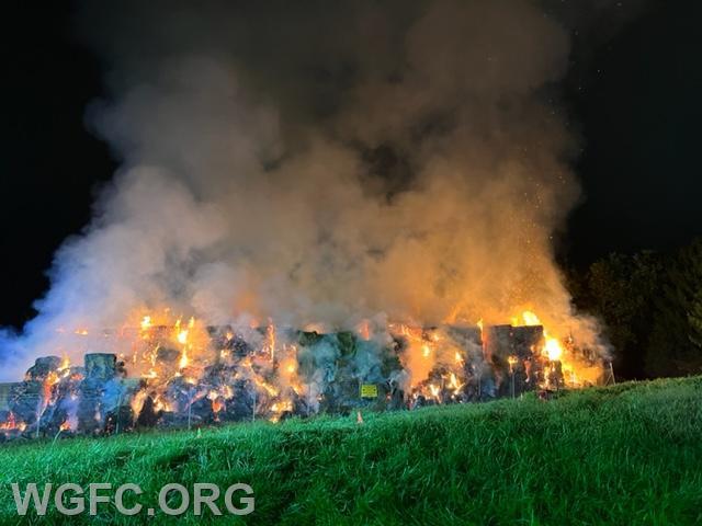 A very large pile of hay and straw bales burned in New Garden Township in an incident that lasted most of Sunday night.