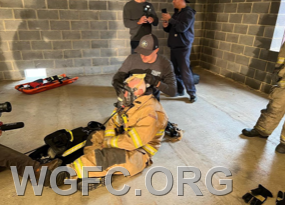 Packing a downed firefighter for removal from a fire scene was part of RIT and survival training. 