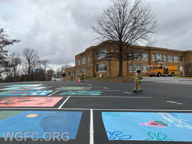 WGFC Engine 22-2's crew sets out a 100 x 100 foot landing zone in the school parking lot (which also serves as a kid's playground).