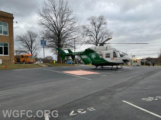 LifeNet 61 sits ready to depart at the Avon Grove Charter School with WGFC Engine 22-2 in the background for an emergeny helicopter transfer to Hershey Medical Center.  