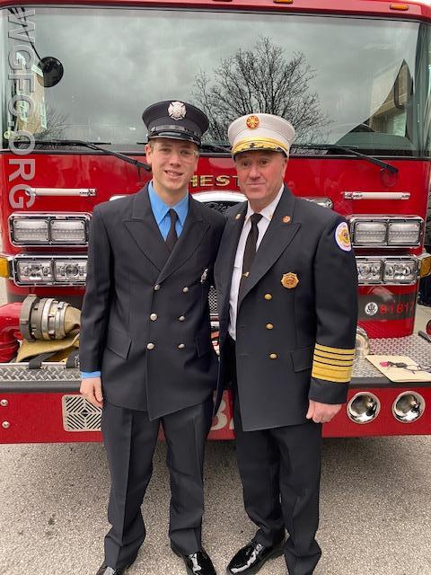 Newly sworn in firefighter Zach Felker with Chester City Fire Commissioner Rigby.