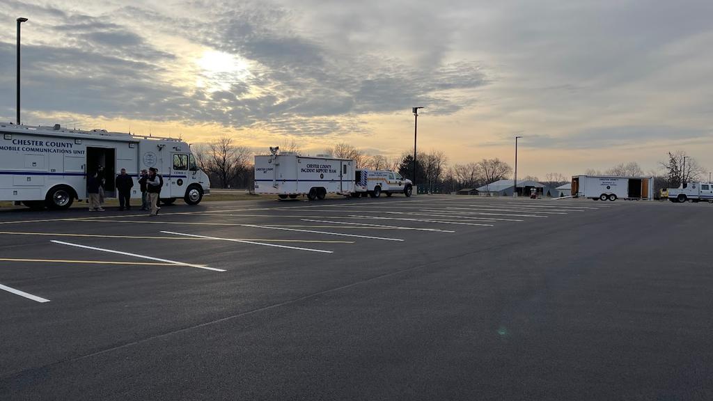 Comm-1 and other units of the Department of Emergency Services are set up in the early morning before the drill. 