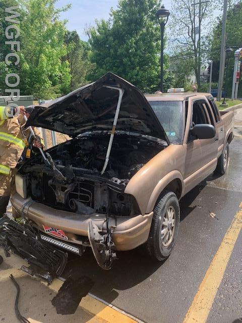 Firefighters complete their work on this pickup that caught on fire.