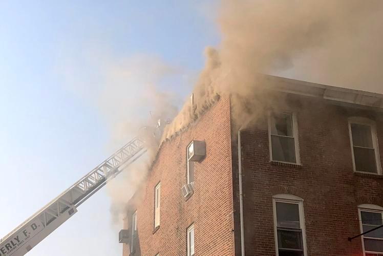 Smoke pushes out of the third floor and attic spaces.  