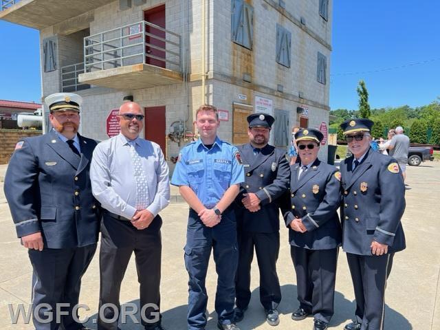 WGFC firefighter Dylan Osborne is pictured with WGFC officers and attendees.
