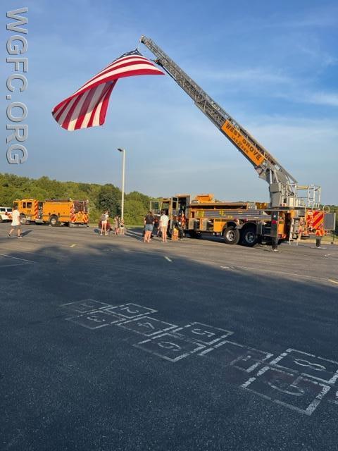 Ladder 22 flies the American flag at the Avon Grove Intermediate School Ice Cream Social.