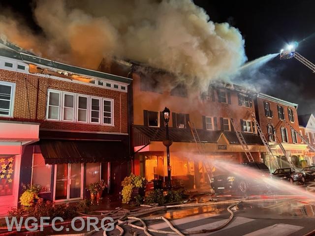 On third street, multiple buildings featuring retail stores on Third Street with apartments above were on fire and total losses.