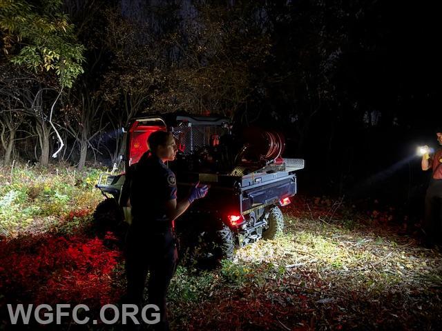 ATV 27 arrives at the scene to help transport the patient out of the woods to a waiting ambulance. 