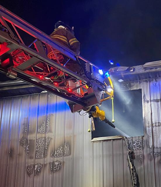 A WGFC firefighter directs flows from the Ladder 22 master stream.