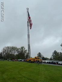 WGFC Ladder 22 flies our large American flag for opening ceremonies for the AG Little League season.