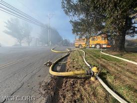 Engine 22-1 on the hydrant at a large hay bale fire along Penn Green Road in New Garden on Friday. 