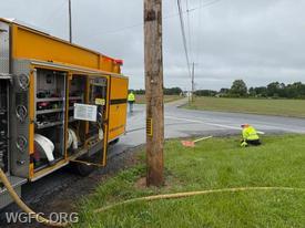Engine 22-3 assists the London Britain Township road crew to clearing clogged stormwater pipes under Flint Hill Road.