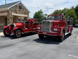 WGFC's Antique 22, also known as Elsie, sits beside Hockessin Engine 19-2 during a visit by the Cradle of Liberty Antique Fire Apparatus Association at Station 23.