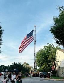 Ladder 22 displays Old Glory at National Night Out in West Grove.