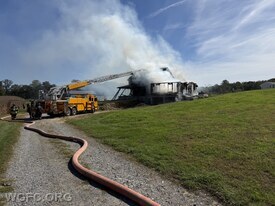 Ladder 22 is has the roof laddered at this Lower Oxford Township house fire Friday. 