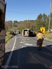 A trash truck struck an RV and flipped onto it's side on Route 841 near Rose Ann Lane in London Grove Thursday, injuring one. 
